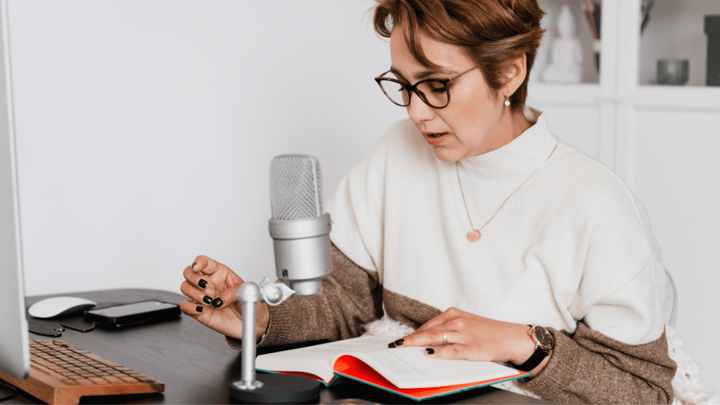 A Woman narrating a story while recording an audiobook - Top 6 Audiobook Publishing Sites Every Author Should Know About